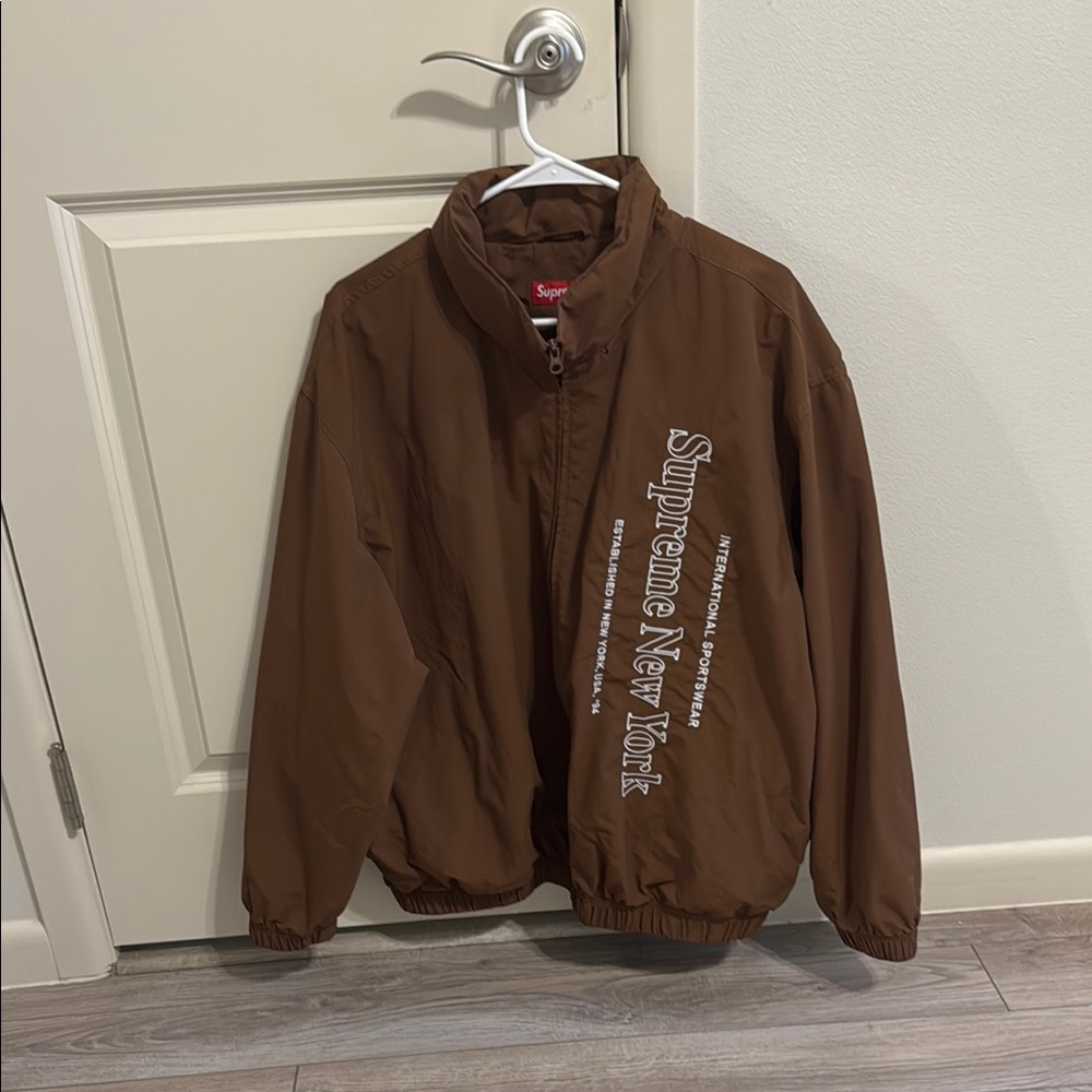 Supreme Brown Windbreaker with Zip-Up Style and Standing Collar